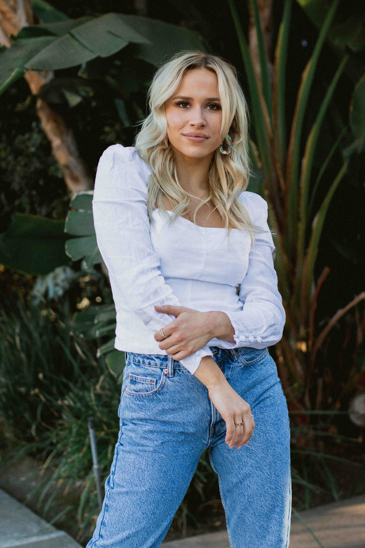 Young Woman Posing for her Instagram Story with Plants Background