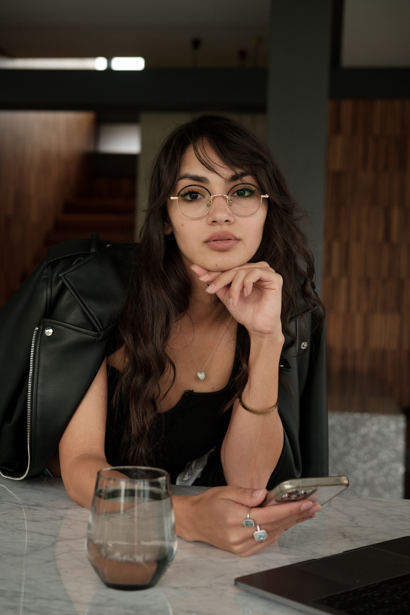 Portrait of Woman with Eyeglasses Holding a Phone 